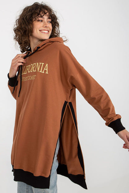 Chic women's long sweatshirt by Factory Price, highlighting its breathable cotton blend fabric and contemporary cut with side slits for a lightweight feel.