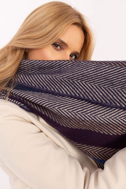 Elegant fringed ends of the luxury viscose shawl scarf by AT, adding a fashionable touch to cold weather outfits.