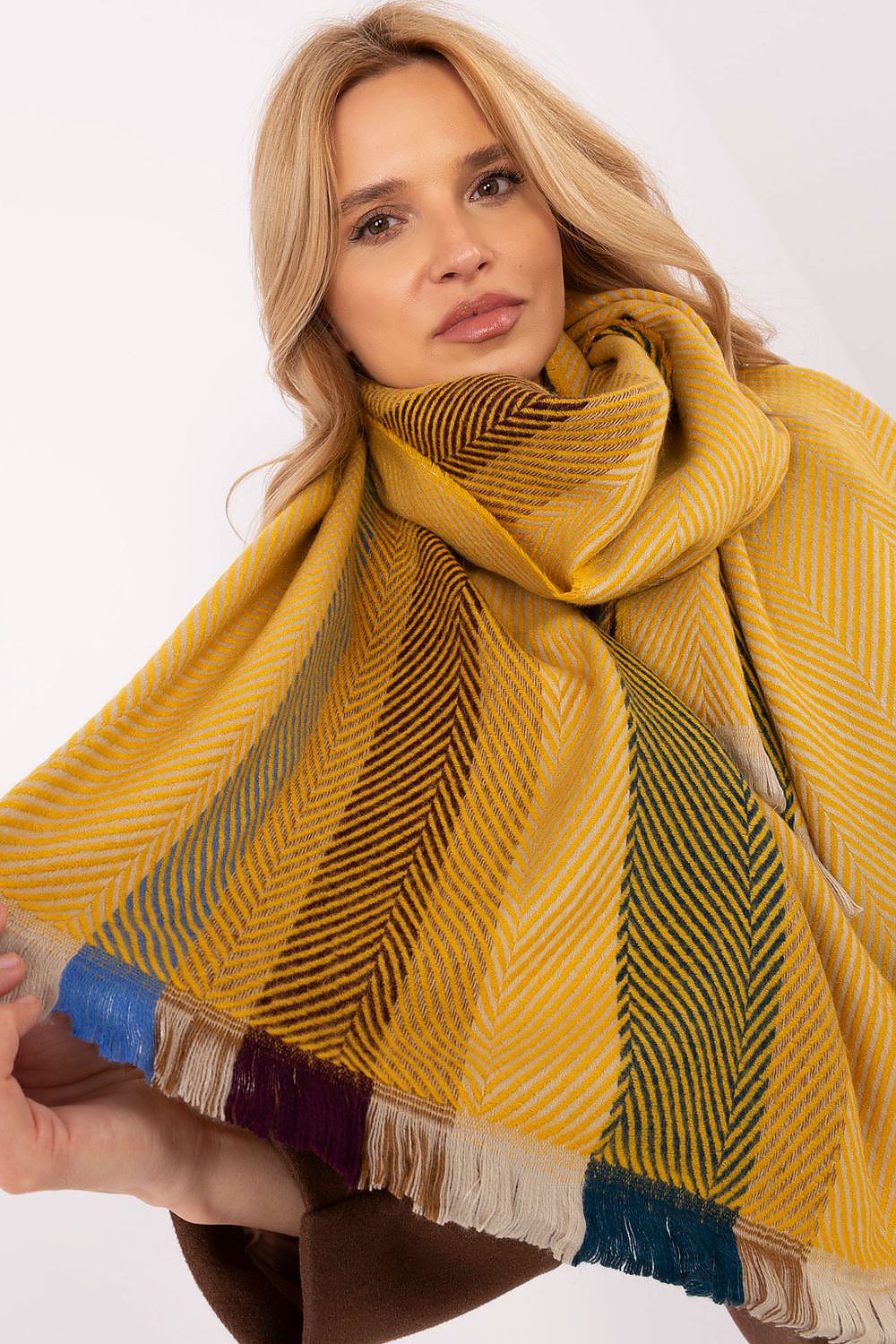 Close-up view of AT's luxury viscose shawl scarf, 194cm long, showcasing a chic striped pattern, ideal for fashionable winter attire.