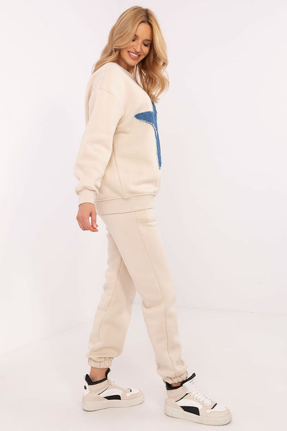 Close-up view of the Luxury Women's Tracksuit Set by Factory Price, highlighting the unique fabric texture of the sweatshirt and pants, ideal for stylish everyday wear.