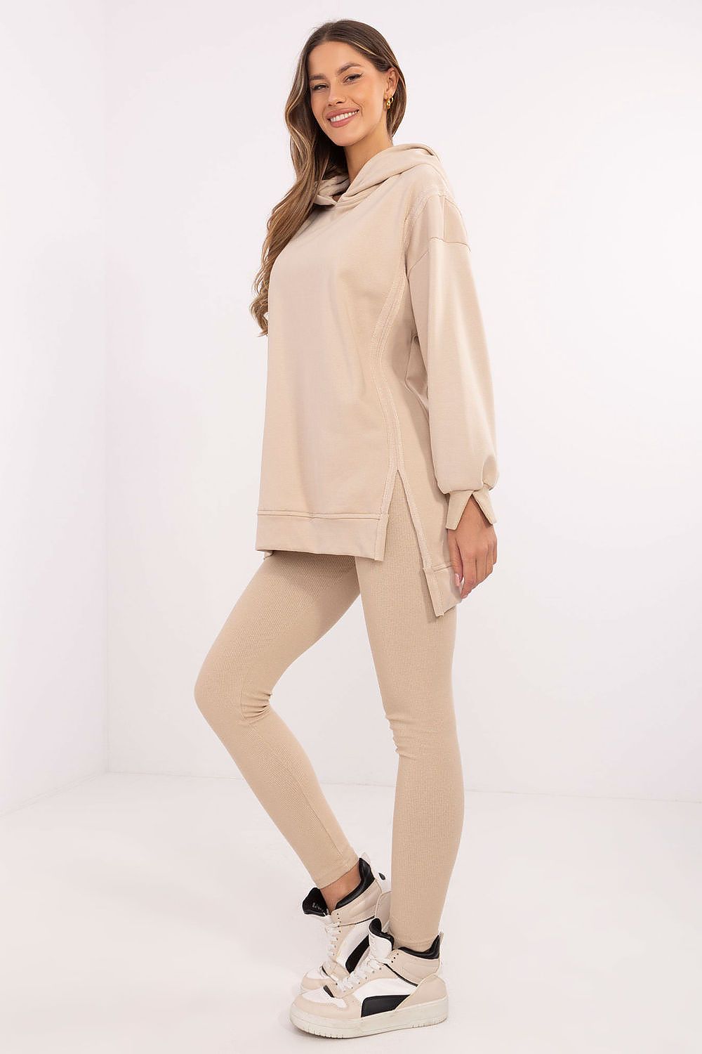 Elegant long sweatshirt from Factory Price in a luxury women's outfit, perfect for casual wear or relaxation, emphasizing a luxurious lifestyle.