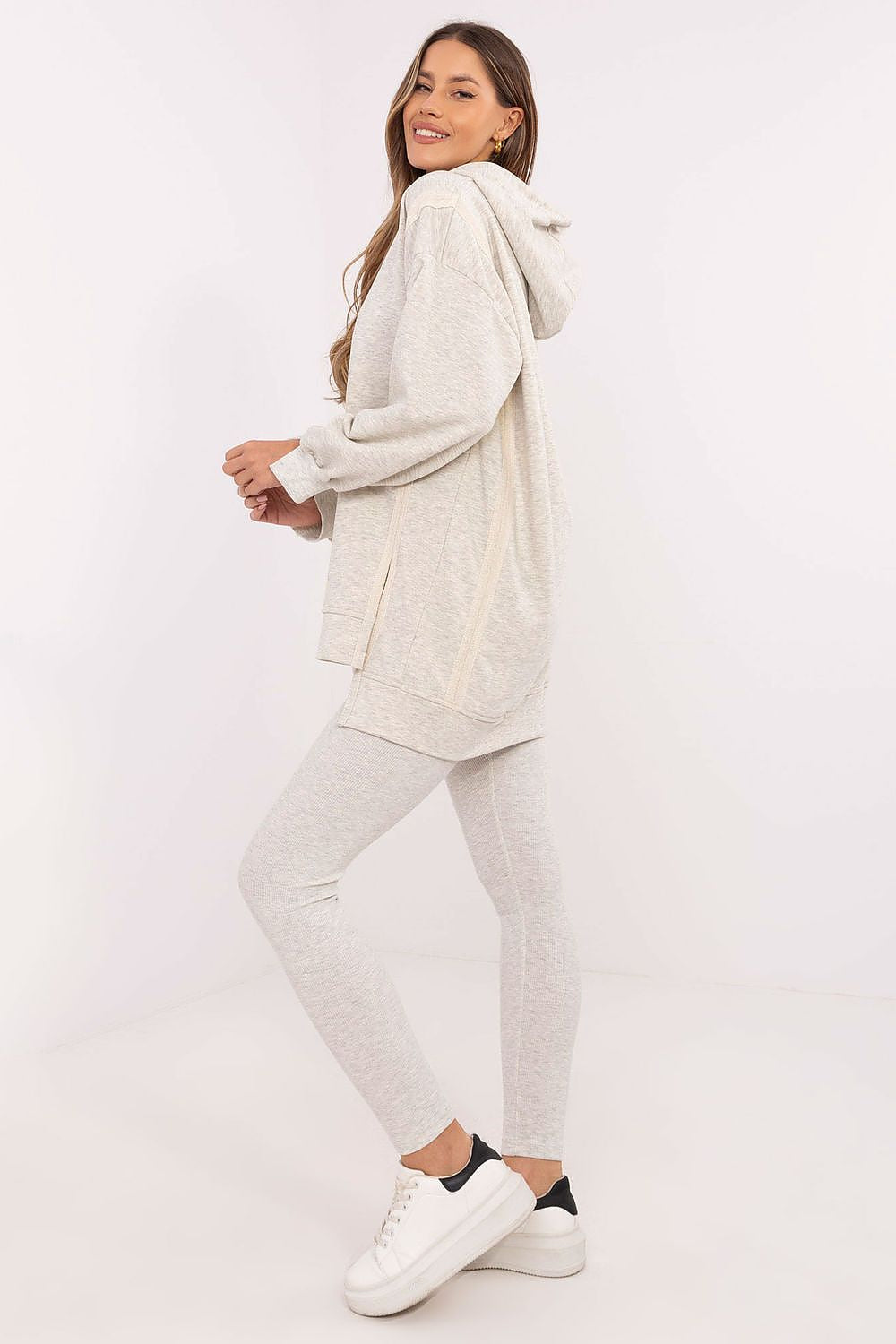 Casual chic women's long sweatshirt and leggings set from Factory Price, showcasing modern design with an elongated back and a luxurious feel in EU size 0.