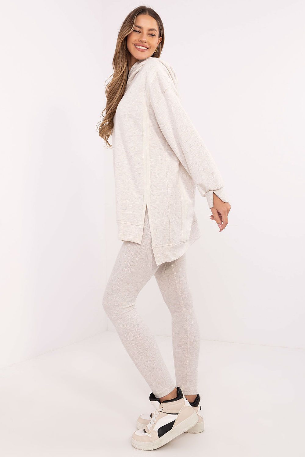 High-waisted leggings and long sweatshirt set for women, crafted by Factory Price, tailored for a flattering silhouette while maintaining comfort and style in EU size 0.