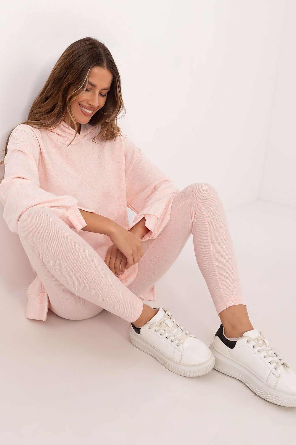 Luxury women's 2-piece set featuring a long sweatshirt and high-waisted leggings, designed for comfort and style by Factory Price. Perfect for casual outings or lounging.