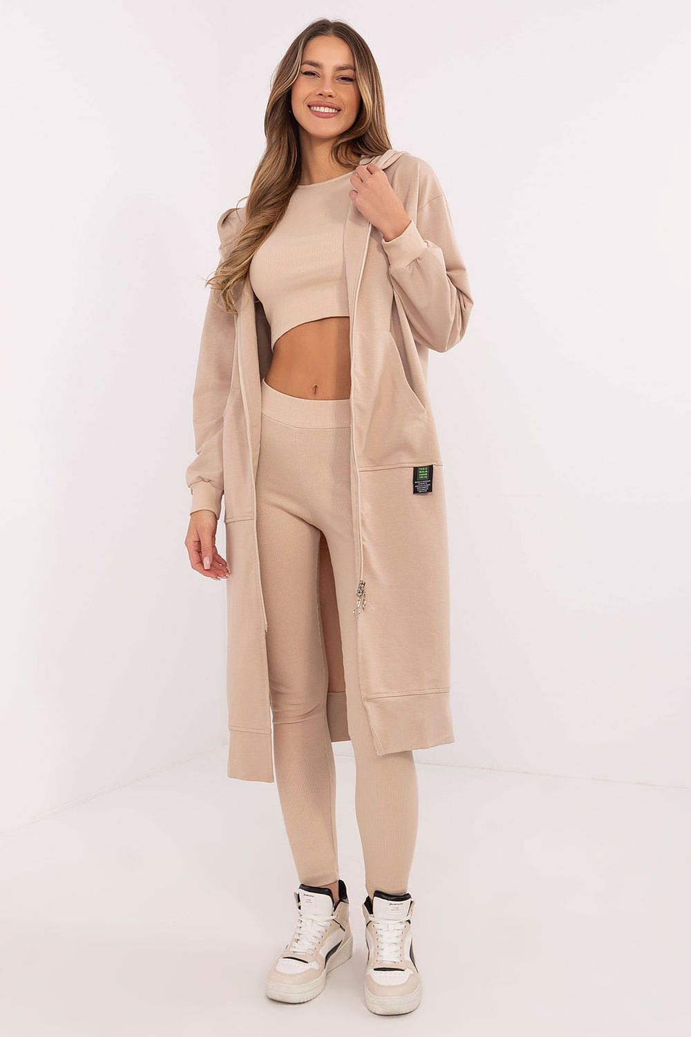 Chic high-waisted leggings from Factory Price's luxury women's set, showcasing a ribbed structure and tapered legs for a flattering silhouette.