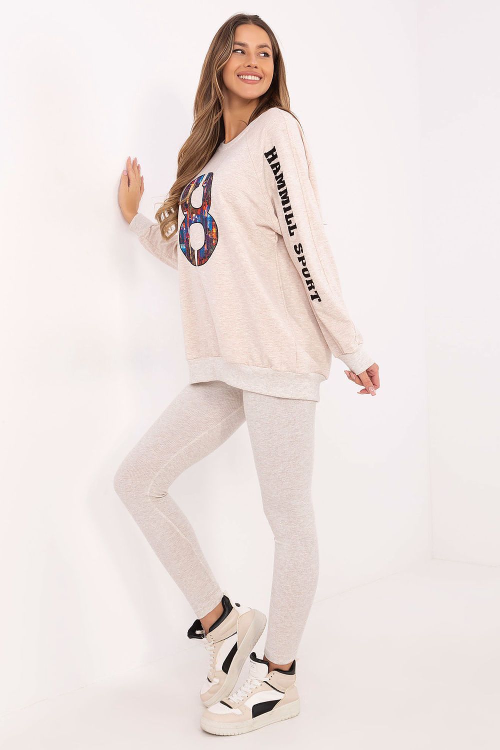 Trendy women's outfit including comfortable sweatshirt and leggings by Factory Price, ideal for everyday casual styling.