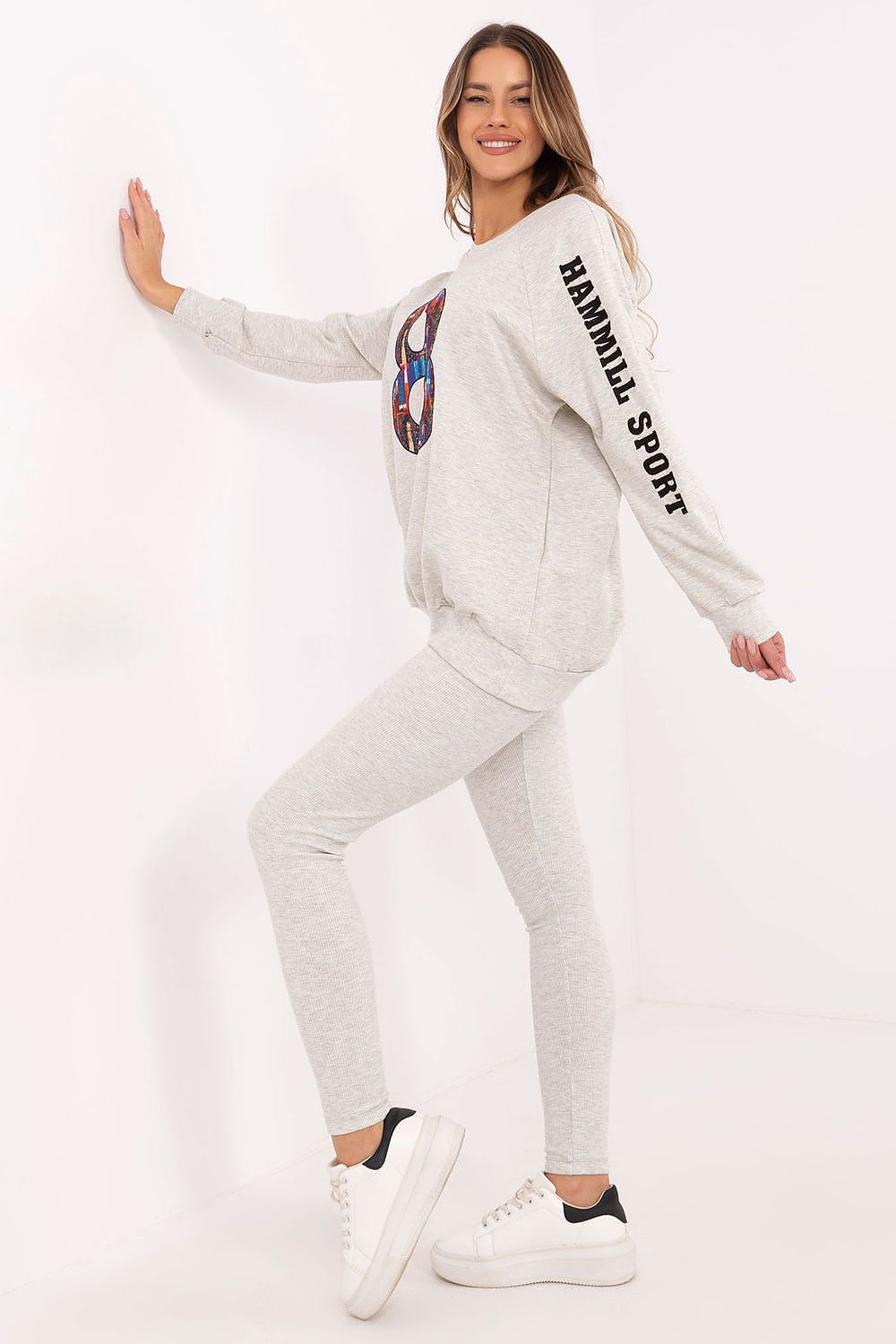 Elegant women's outfit featuring a classic sweatshirt and tapered leggings by Factory Price, ideal for comfort and fashion.