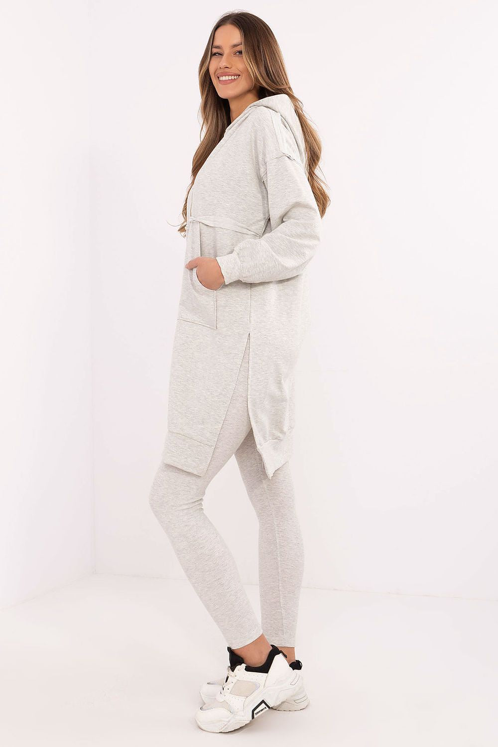 Luxury women's hoodie and leggings set by Factory Price, crafted from a soft cotton blend for ultimate comfort and style, perfect for casual wear.