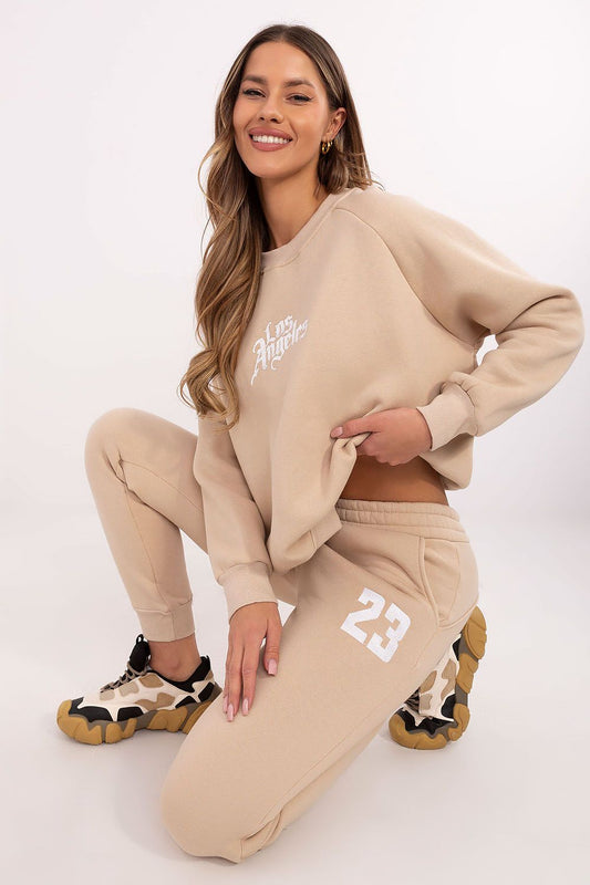 Elegant luxury women's tracksuit set with a classic sweatshirt adorned with embroidered designs and high waist pants, designed by Factory Price for ultimate comfort and style.