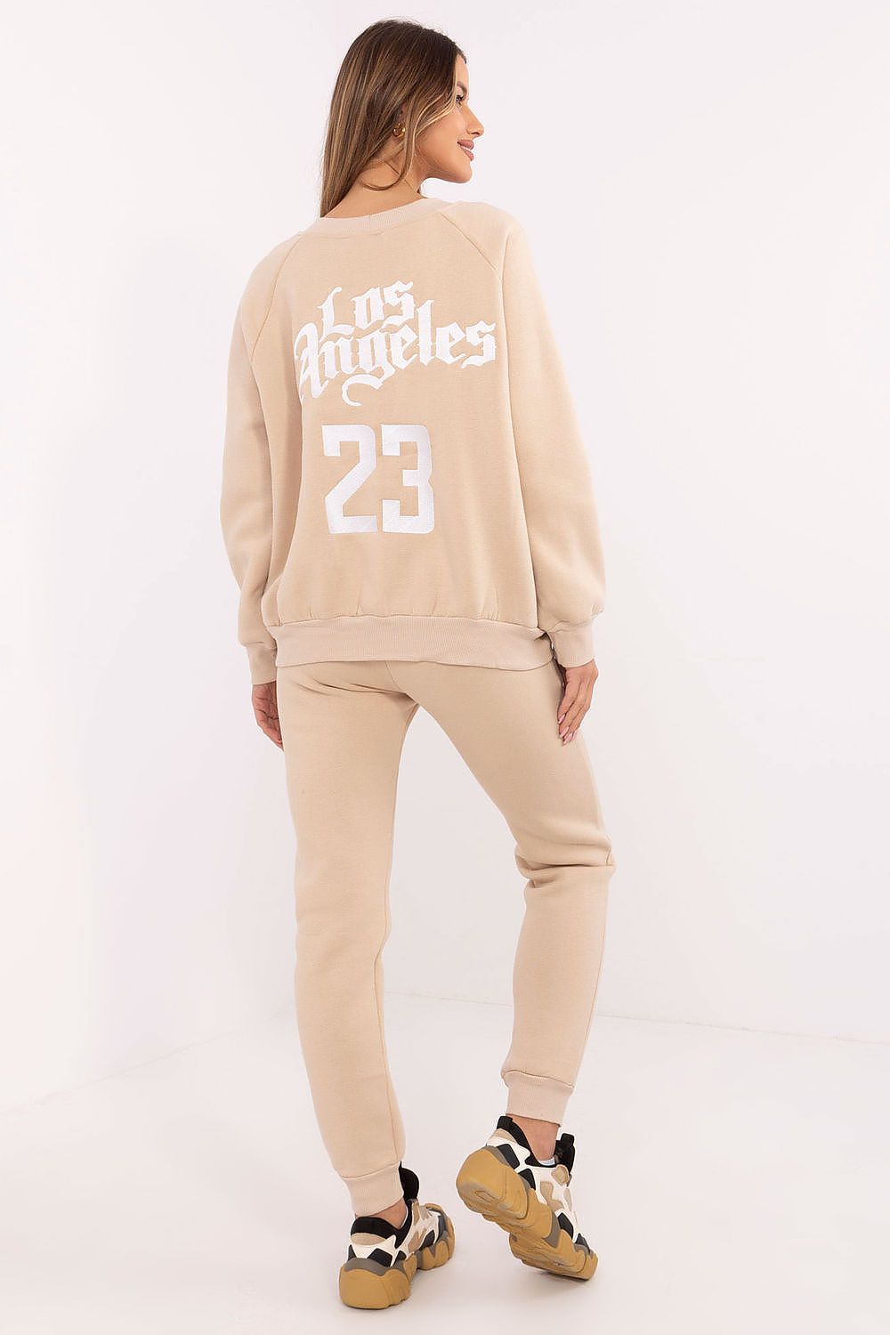 Luxury women's tracksuit set by Factory Price featuring a stylish sweatshirt and high waist pants made from a comfortable cotton-polyester blend.