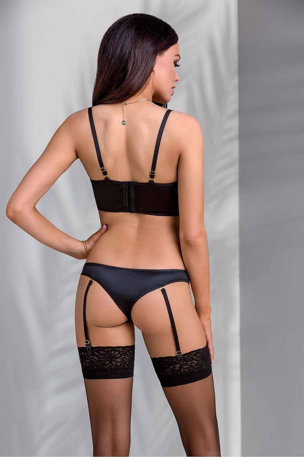 Luxurious Casmir Lara black lingerie ensemble comprising of a sophisticated half-corset and string, made from premium materials for an exquisite fit and feel.