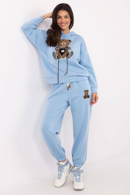 Luxurious women's tracksuit set by Italy Moda featuring a stylish hoodie with teddy bear patch and matching pants,perfect for casual and comfortable wear.