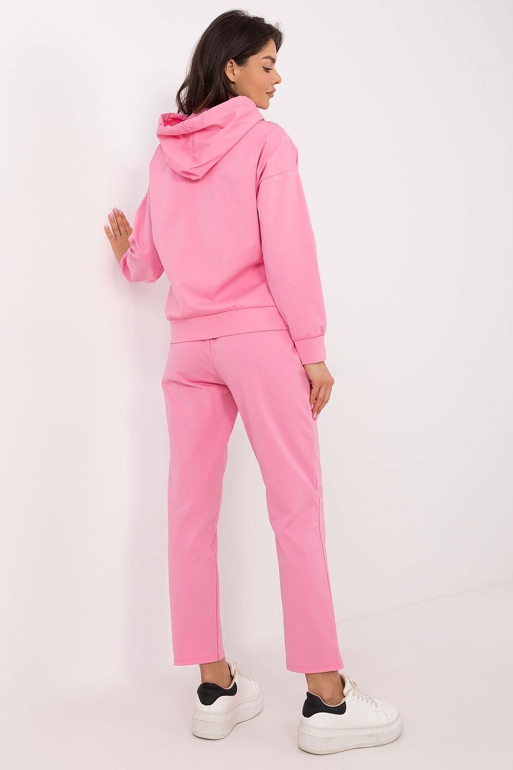 Close-up of the luxurious hooded sweatshirt from the Italy Moda women's tracksuit set, showcasing its delicate teddy bear-shaped patch and soft texture.