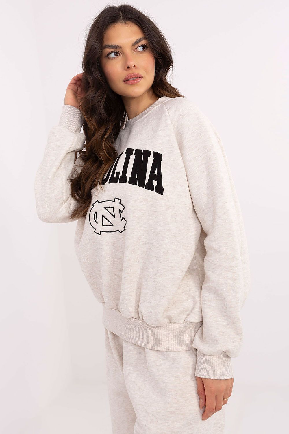 Side view of luxury women's sweatshirt from Factory Price showcasing long sleeves and fashionable fit suitable for various outfits.