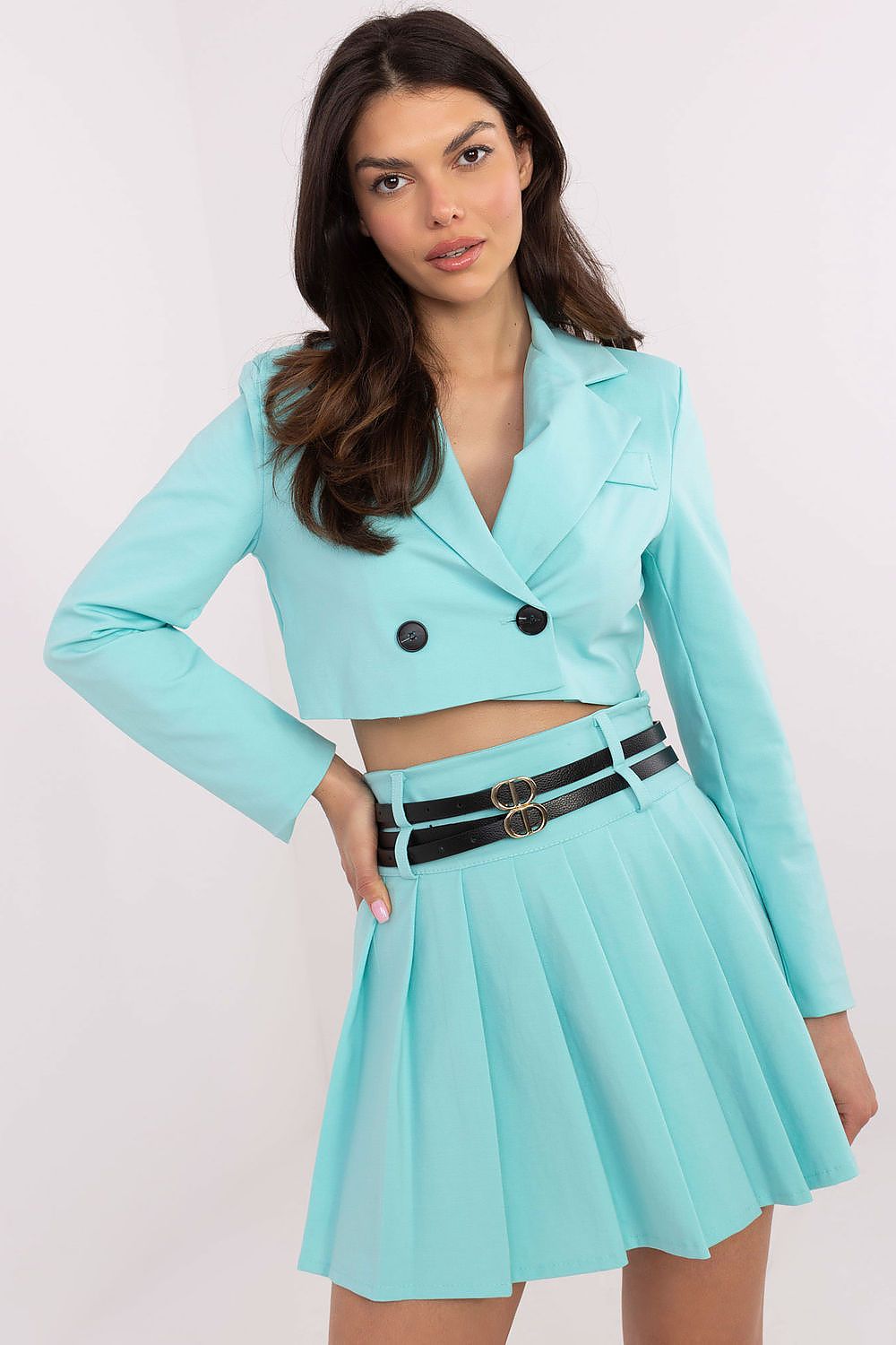 Close-up of the Italy Moda pleated mini skirt's fabric, highlighting its luxurious cotton, nylon, and elastane blend.