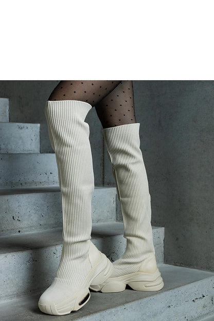 Solea elegant beige thigh-high boots featuring a stylish elastic collar, perfect for autumn and winter fashion. Available in EU sizes 36-41 with an 8 cm heel, these slip-on boots offer a luxurious blend of comfort and chic design.