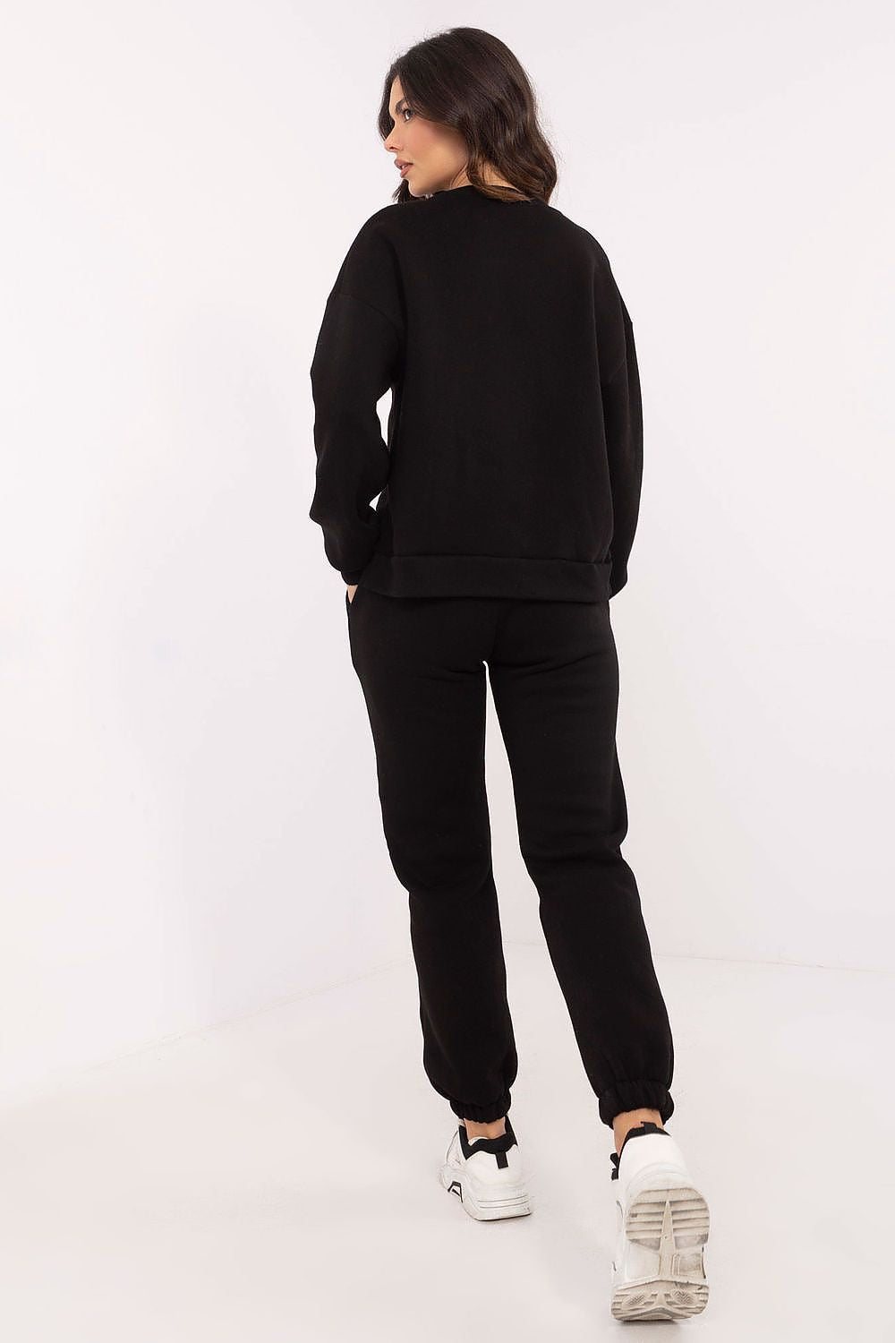 Side view of the luxurious hoodie with long sleeves and round neckline from the Factory Price cotton-polyester set, accentuating its fashionable silhouette.