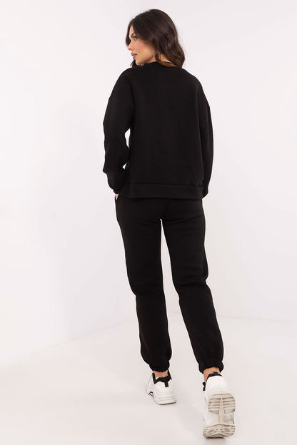 Side view of the luxurious hoodie with long sleeves and round neckline from the Factory Price cotton-polyester set, accentuating its fashionable silhouette.