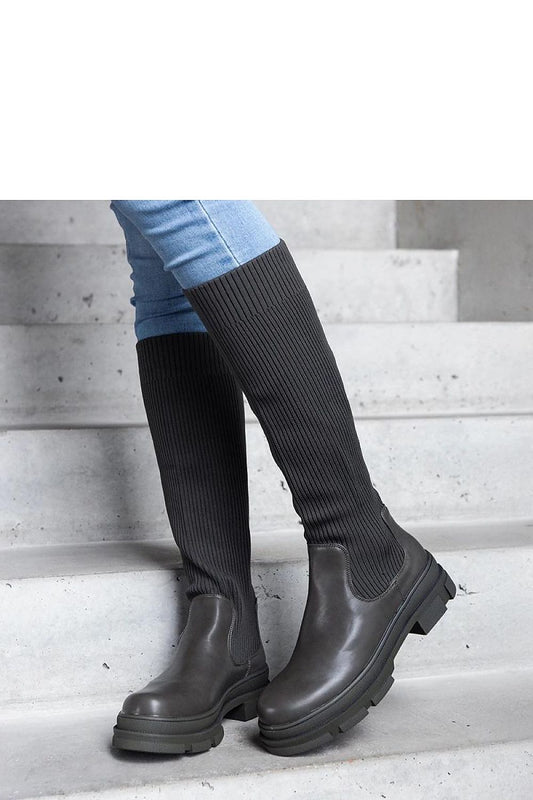 Solea women's Elthea thigh-high boots, showcasing an almond toe and durable rubber construction for stylish comfort.