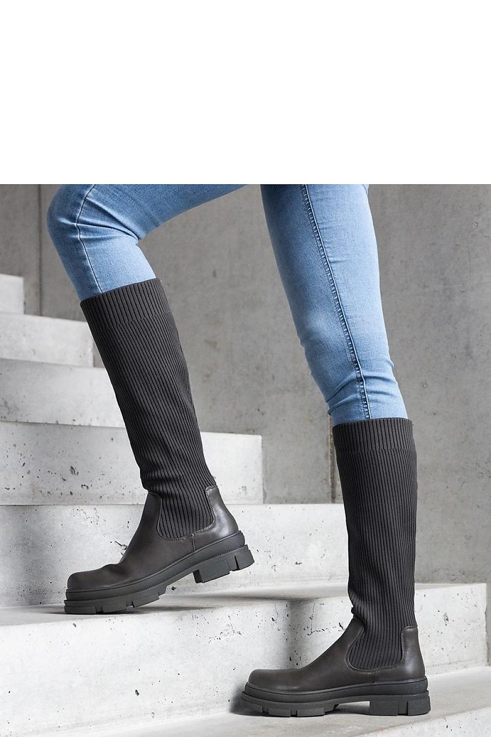Elegant Solea green Elthea thigh-high boots displaying a contemporary chunky sole and luxurious insulation for warmth.