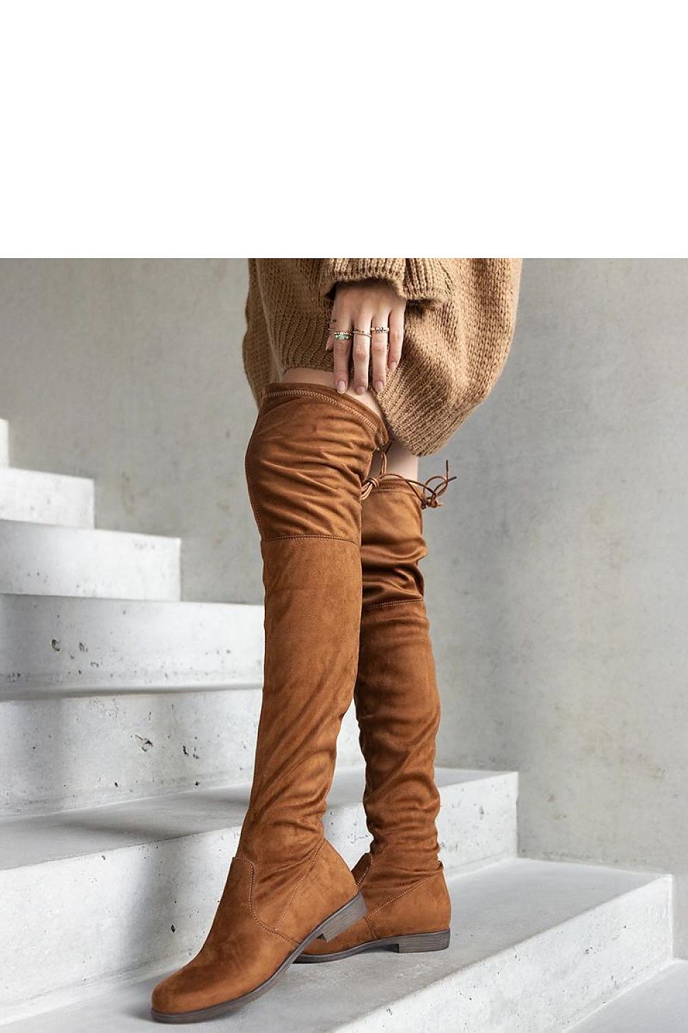 Elegant view of Solea brown long platform boots with almond toe, crafted from eco-suede, ideal for chic autumn outfits.