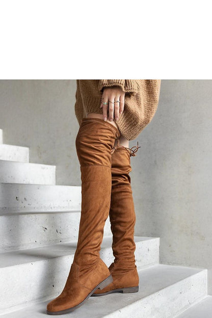 Elegant view of Solea brown long platform boots with almond toe, crafted from eco-suede, ideal for chic autumn outfits.