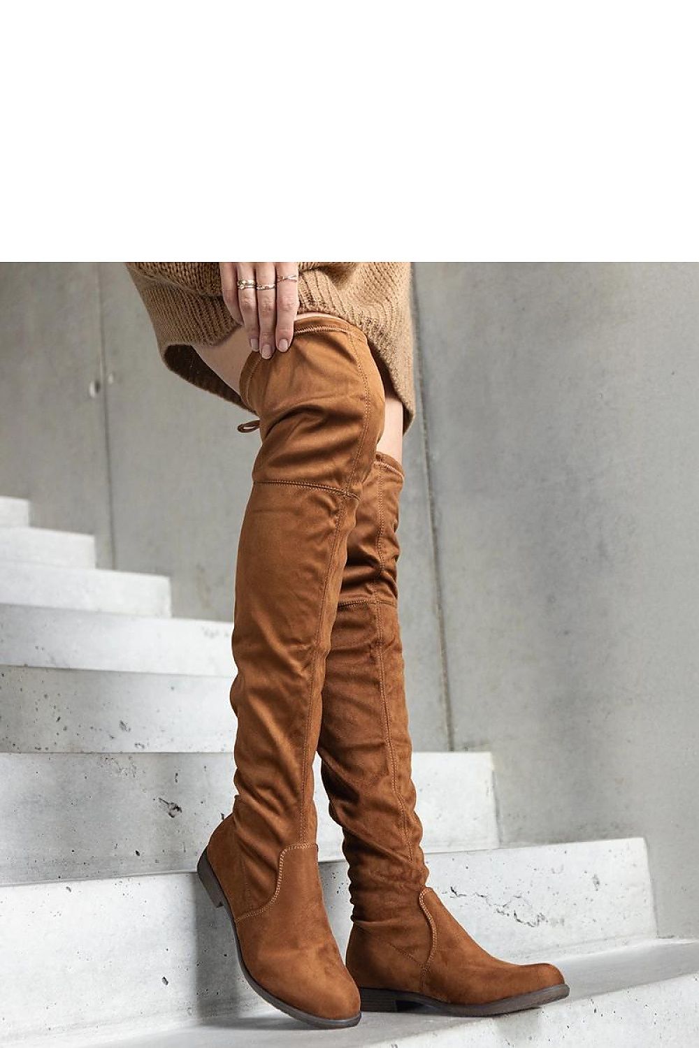 Solea brown eco-suede thigh-high platform boots displayed elegantly, highlighting their comfort and contemporary style for a fashionable winter look.