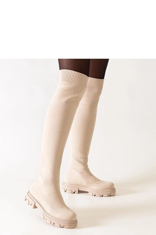 Solea insulated long heel boots in elegant beige, showcasing the stylish Athira platform design, perfect for chic winter outings.