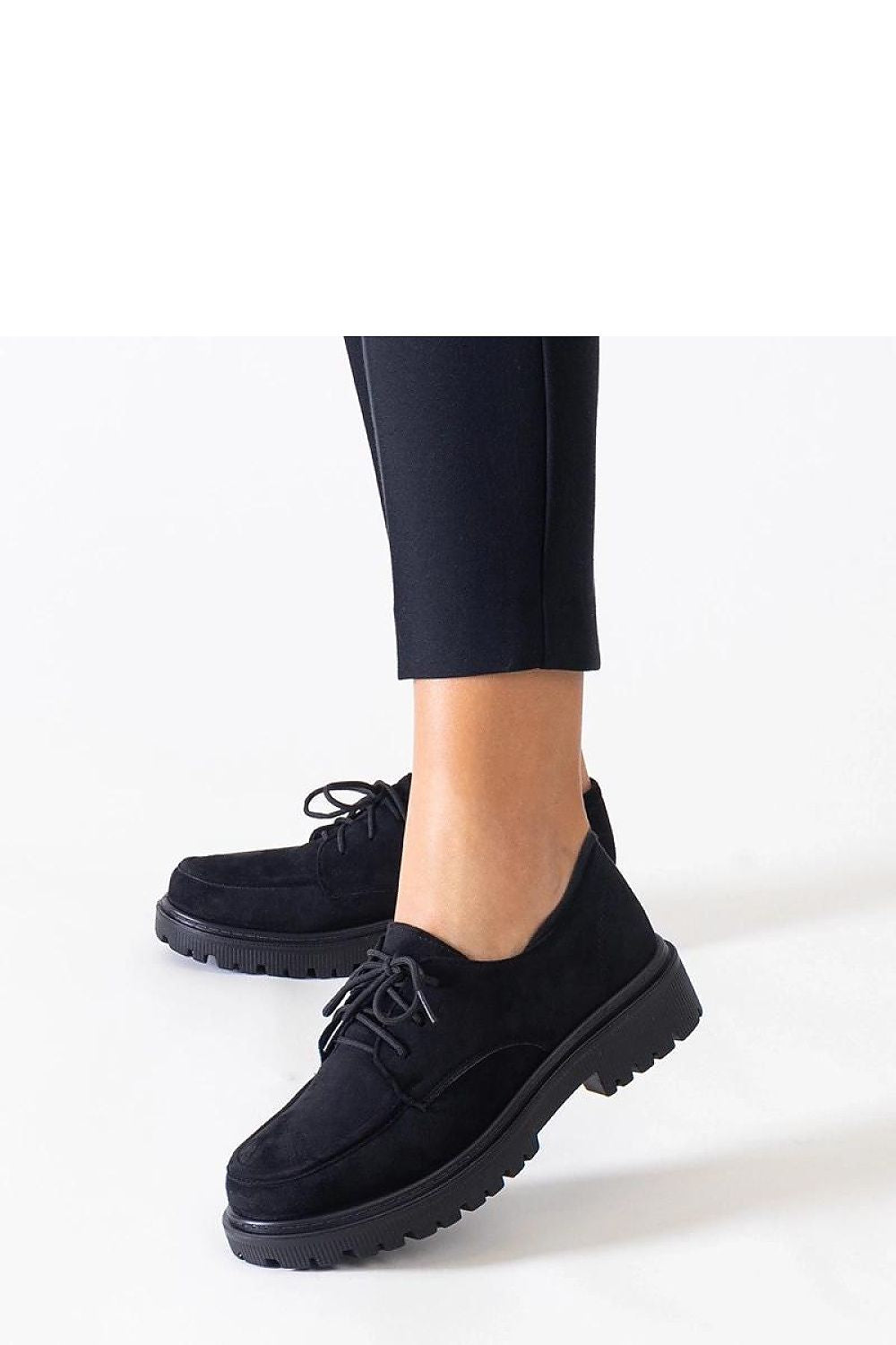 Solea Eco-Suede Lace-Up Shoes displayed on various surfaces, highlighting the exceptional grip and stability of the rubber sole for fashionable comfort.