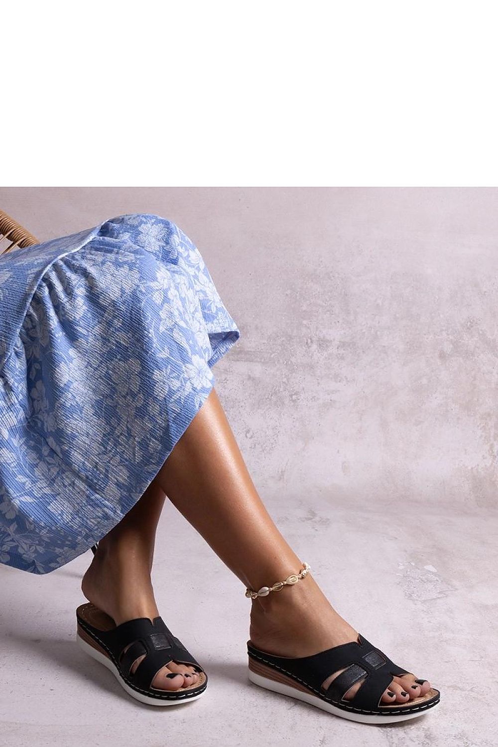 Luxurious Solea brown eco-leather sandals featuring a comfortable slip-on design and a 5cm wedge for sophisticated summer wear.