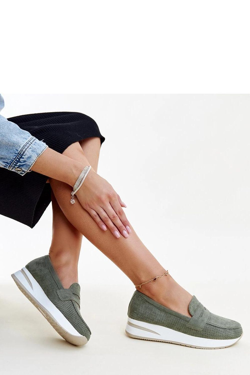 Close-up of Solea pink Muna loafers, highlighting the intricate perforated design and rubber sole for utmost comfort and style.