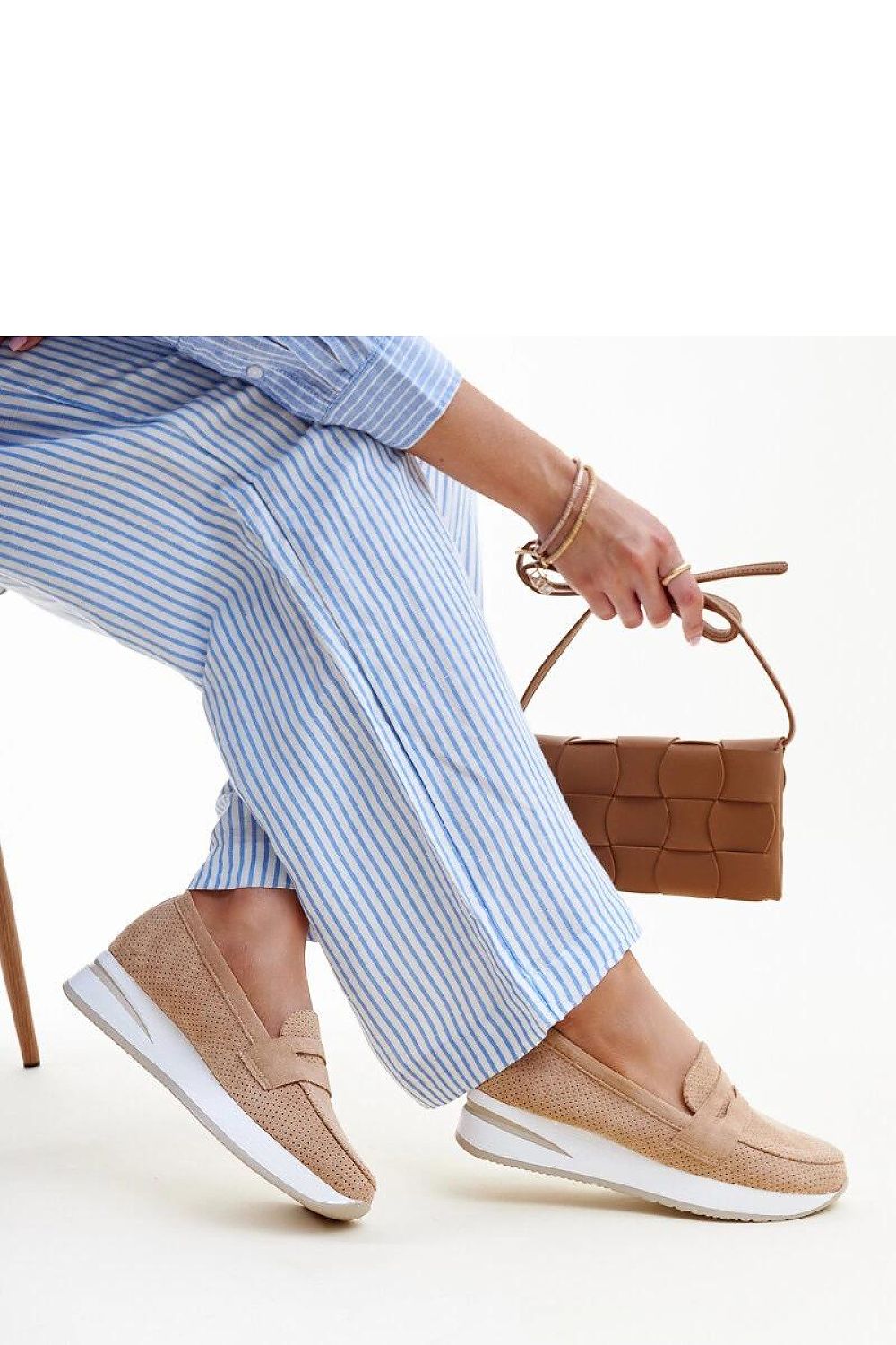 Solea summer slip-on pink Muna loafers beautifully styled against a fashionable backdrop, perfect for enhancing your seasonal wardrobe.