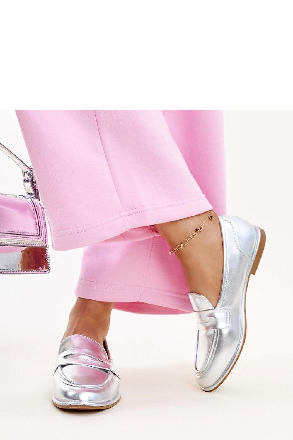 Close-up of Solea silver moccasins Nasia, showcasing high-quality synthetic leather and stylish metallic finish, ideal for a chic spring/summer wardrobe.