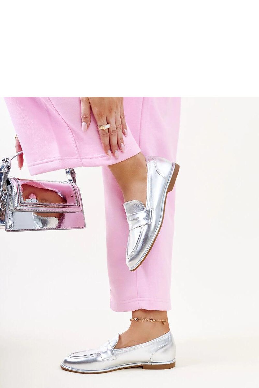 Elegant Solea silver classic moccasins Nasia displayed against a soft background, highlighting their lightweight comfort and sophisticated slip-on style.