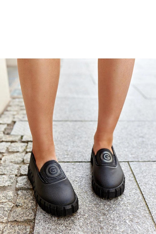 Elegant Solea black faux suede loafers on a 4cm massive sole, showcasing modern slip-on footwear with almond-shaped toe design, perfect for both casual and special occasions.