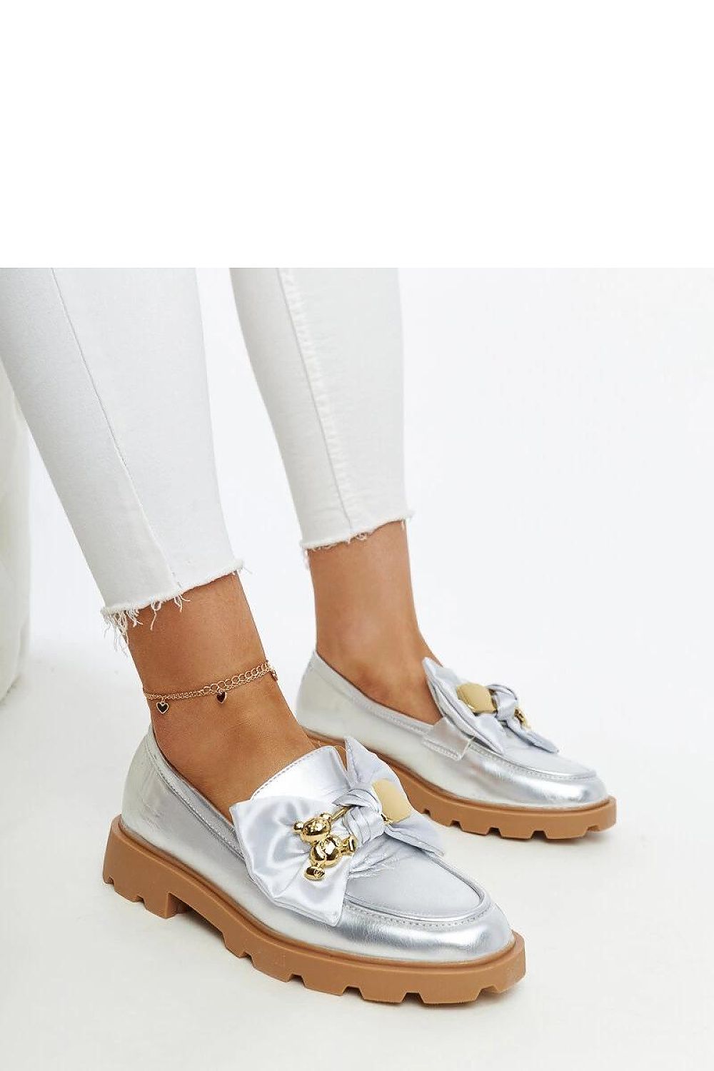 Elegant Solea Silver Moccasins featuring a decorative buckle, perfect for stylish occasions and available in sizes EU 36-41.