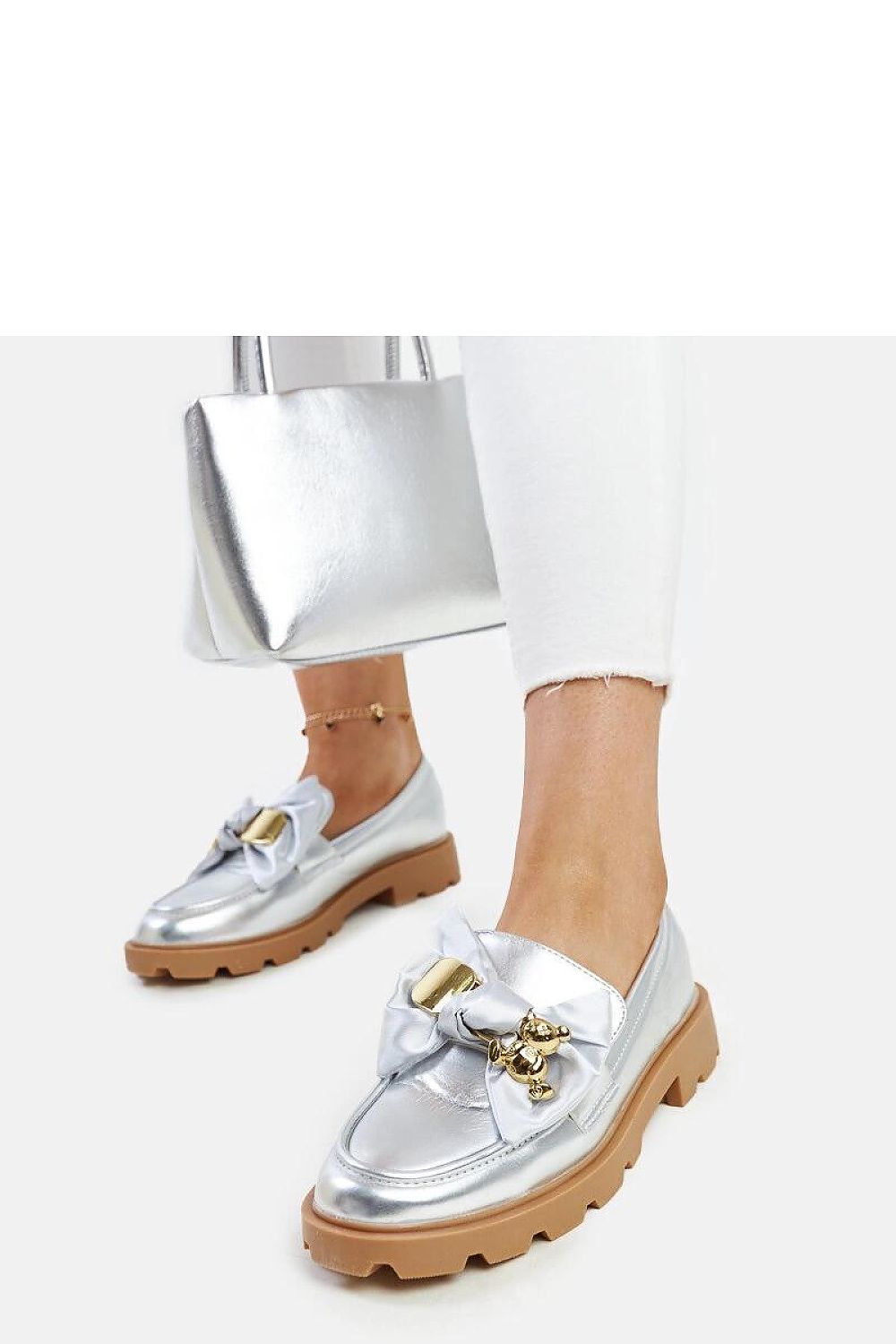 Sophisticated Solea slip-on moccasins with a metallic sheen, designed with a decorative buckle for added elegance, suitable for any spring/summer outfit.