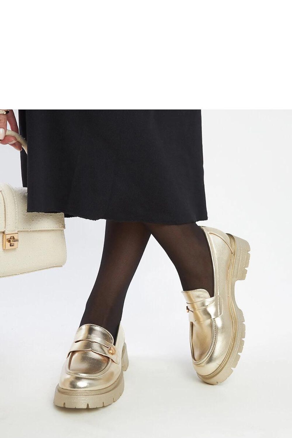 Solea Eko Leather Moccasins displayed on a plush surface, highlighting the refined rounded toe and comfortable slip-on feature.