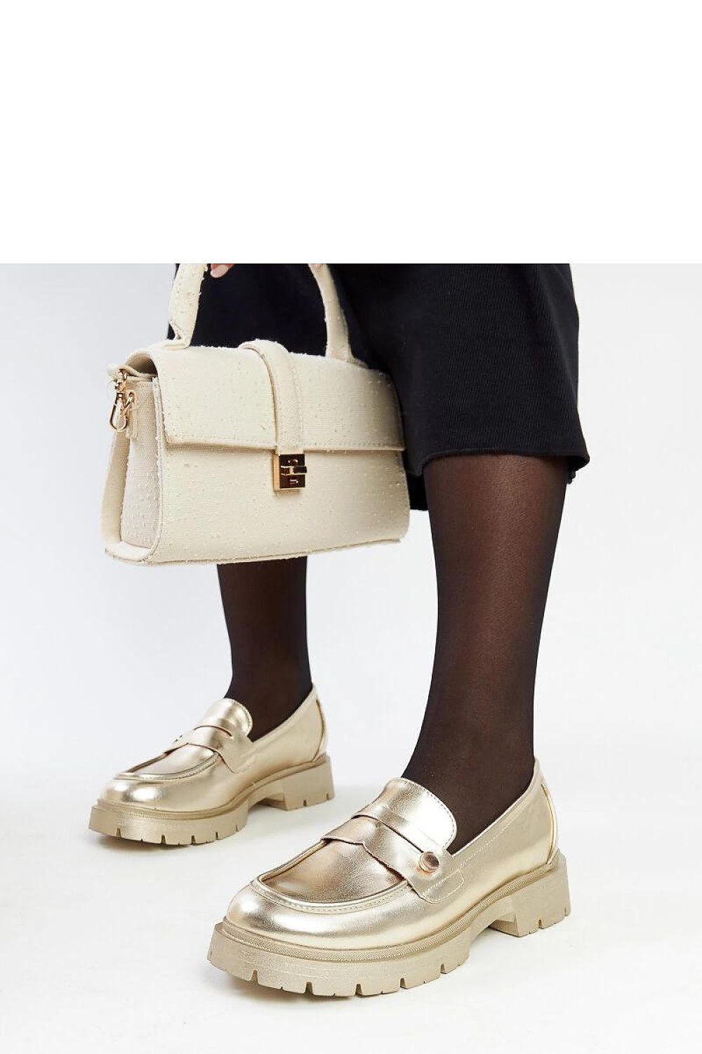 Elegant Solea moccasins in dark green against a premium backdrop, representing luxury and comfort in everyday footwear.