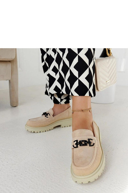 Elegantly designed Solea beige suede moccasins featuring a chic buckle on a thick sole, showcasing a perfect blend of style and comfort for fashionable women.