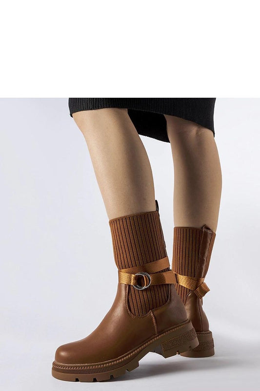 Solea luxurious brown fleece-lined heel boots displayed elegantly, showcasing high ankle design and round toe for a stylish look.