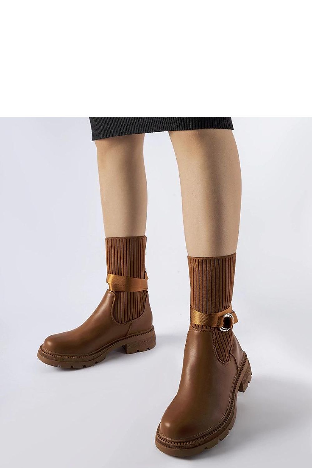 Interior view of Solea exquisite brown fleece-lined heel boots, highlighting the insulated comfort and soft lining for warmth.