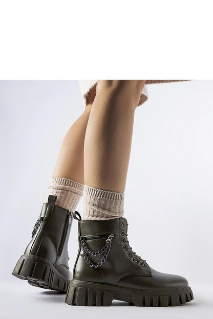 Luxurious Solea dark green ankle boots featuring a stylish pocket, crafted from eco-leather for sustainable sophistication.