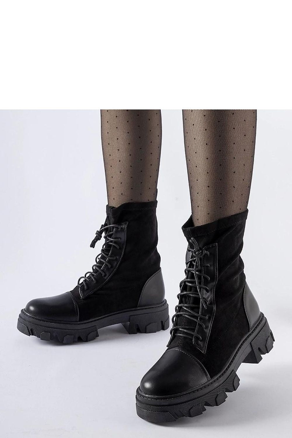 Elegant Solea black vegan leather slip-on boots with stylish lacing Tarces, showcasing their sophisticated design and comfort.