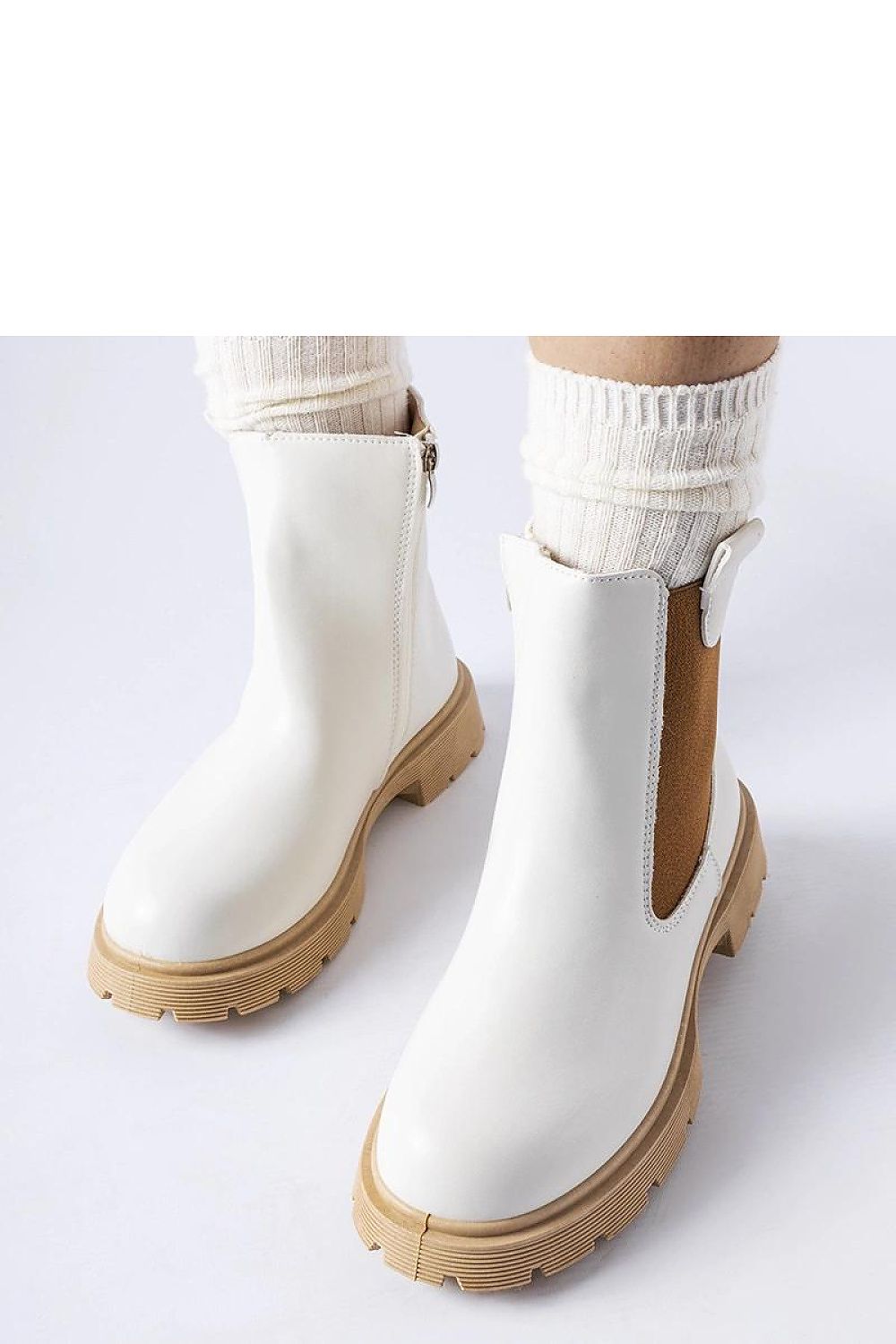Solea white ankle boots with beige sole, crafted from eco leather, showcasing their chic design and round toe, ideal for stylish and comfortable wear.
