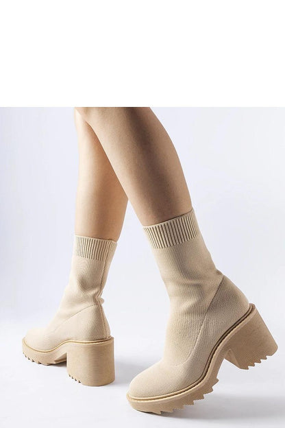 High-quality Solea Cadiz ankle boots in beige, designed with a flexible elastic shaft and chic 7cm heel, ideal for fashionable women seeking comfort and style.