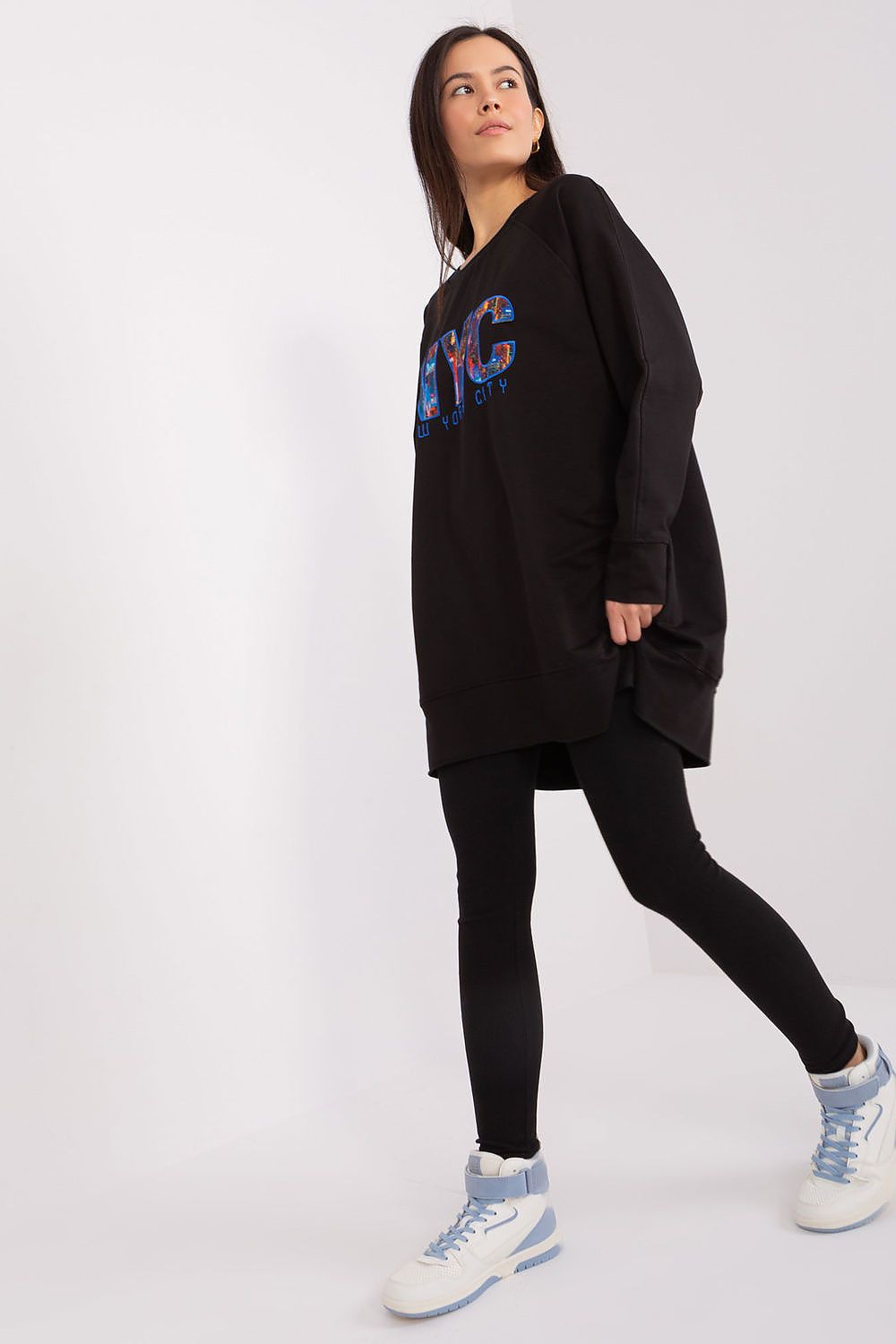 Luxury women's athleisure set by Factory Price, including stylish tapered leggings and a printed sweatshirt, designed for comfort and contemporary style.