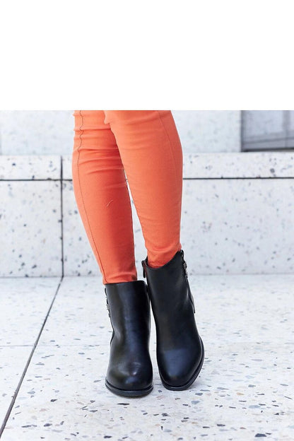 Stylish and warm black eco-leather stiletto boots by Solea, showcasing a chic zipper closure and elegantly embellished with zircons.