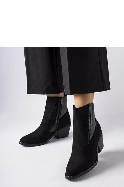 Close-up of Solea Women’s eco-suede black low-post heel boots, highlighting the stylish pointed toe and zipper detail, perfect for the modern woman.