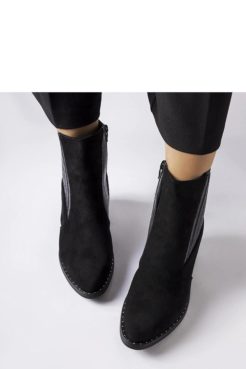 Solea Women’s Eco-Suede Black Low-Post Heel Boots showcasing their elegant design and comfortable fit, perfect for stylish autumn outfits.